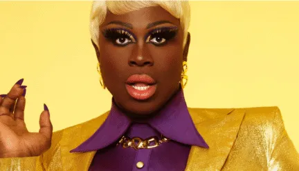 person in suit with yellow background